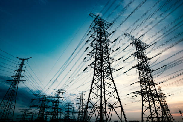 High voltage towers in the dusk of the evening